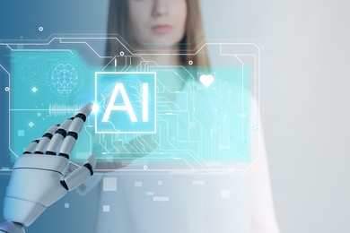 Illustration of Robot hand and doctor using AI virtual screen against color background, closeup. Artificial intelligence in medicine