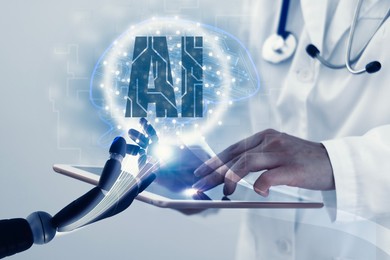 Illustration of Doctor using tablet computer, closeup. Robot hand touching virtual screen above device. Artificial intelligence in medicine