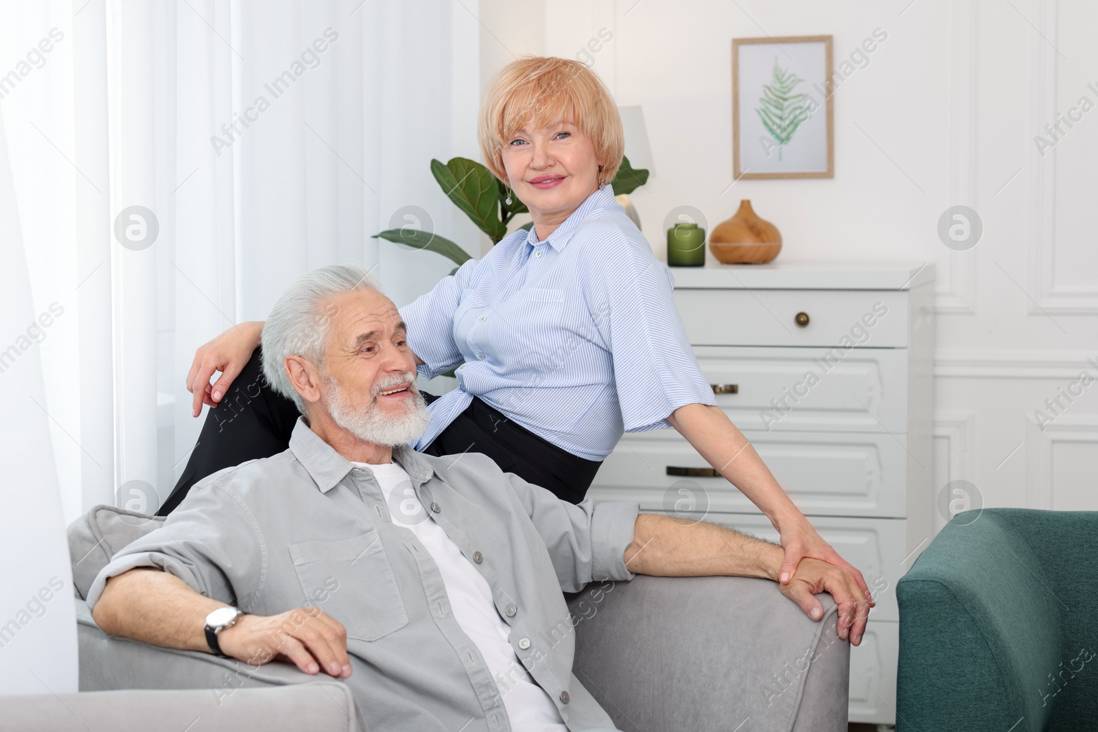 Photo of Lovely senior couple spending time together at home