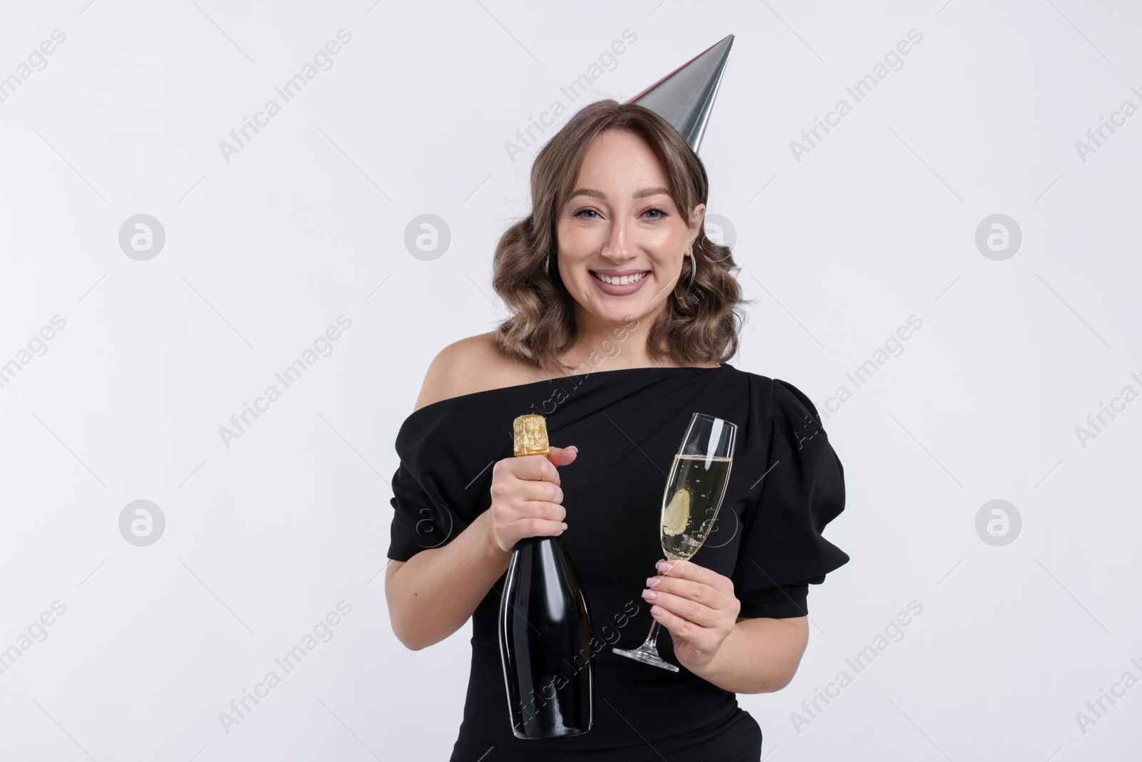Photo of Birthday celebration. Woman with sparkling wine on white background
