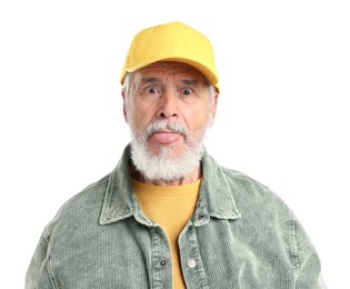 Photo of Elderly man in stylish outfit showing his tongue on white background