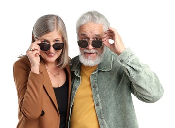 Photo of Senior couple in stylish outfits on white background