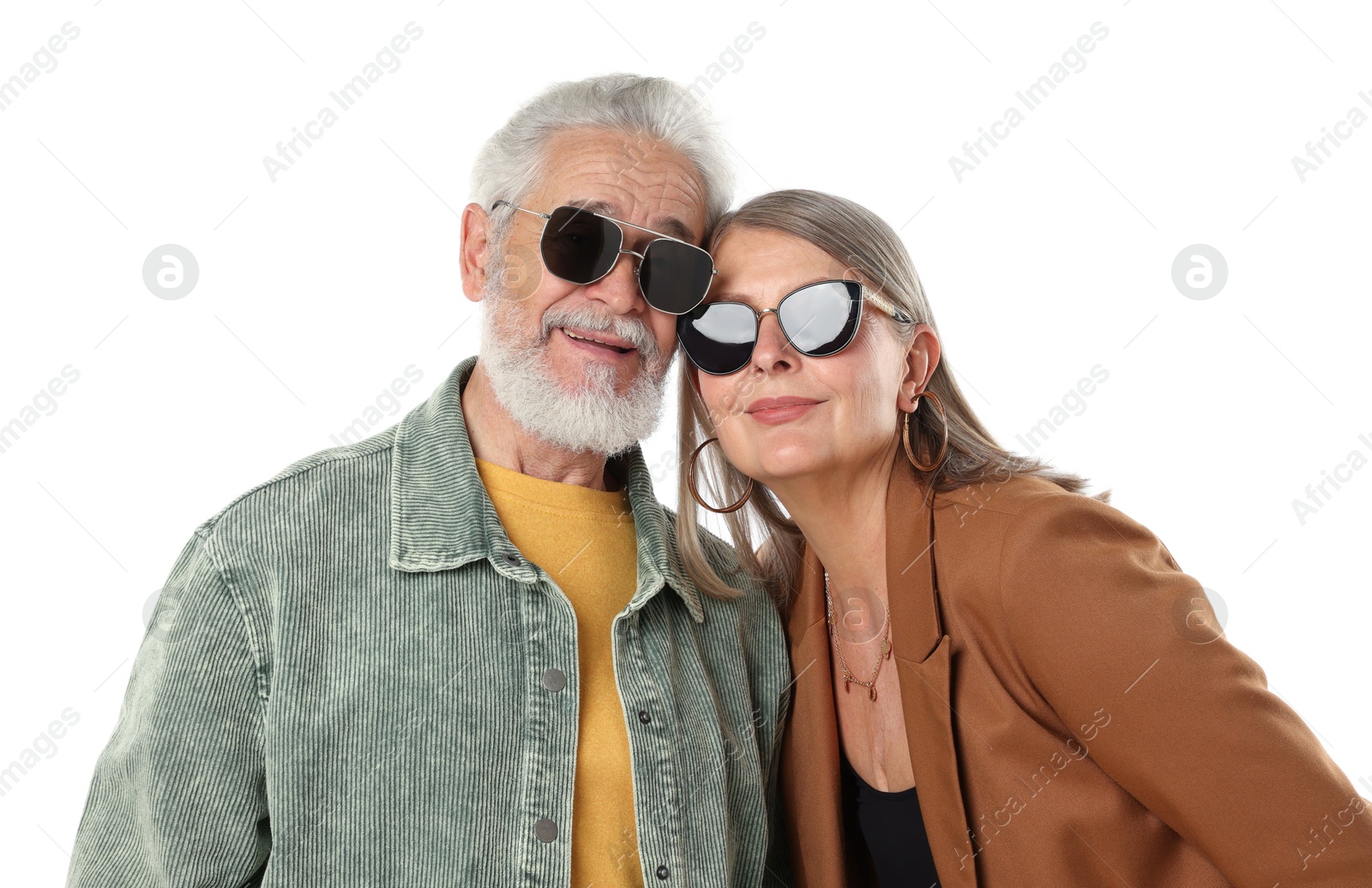 Senior couple in stylish outfits on white background Photo of Senior couple in stylish outfits on white background