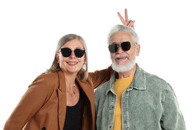 Photo of Senior couple in stylish outfits on white background