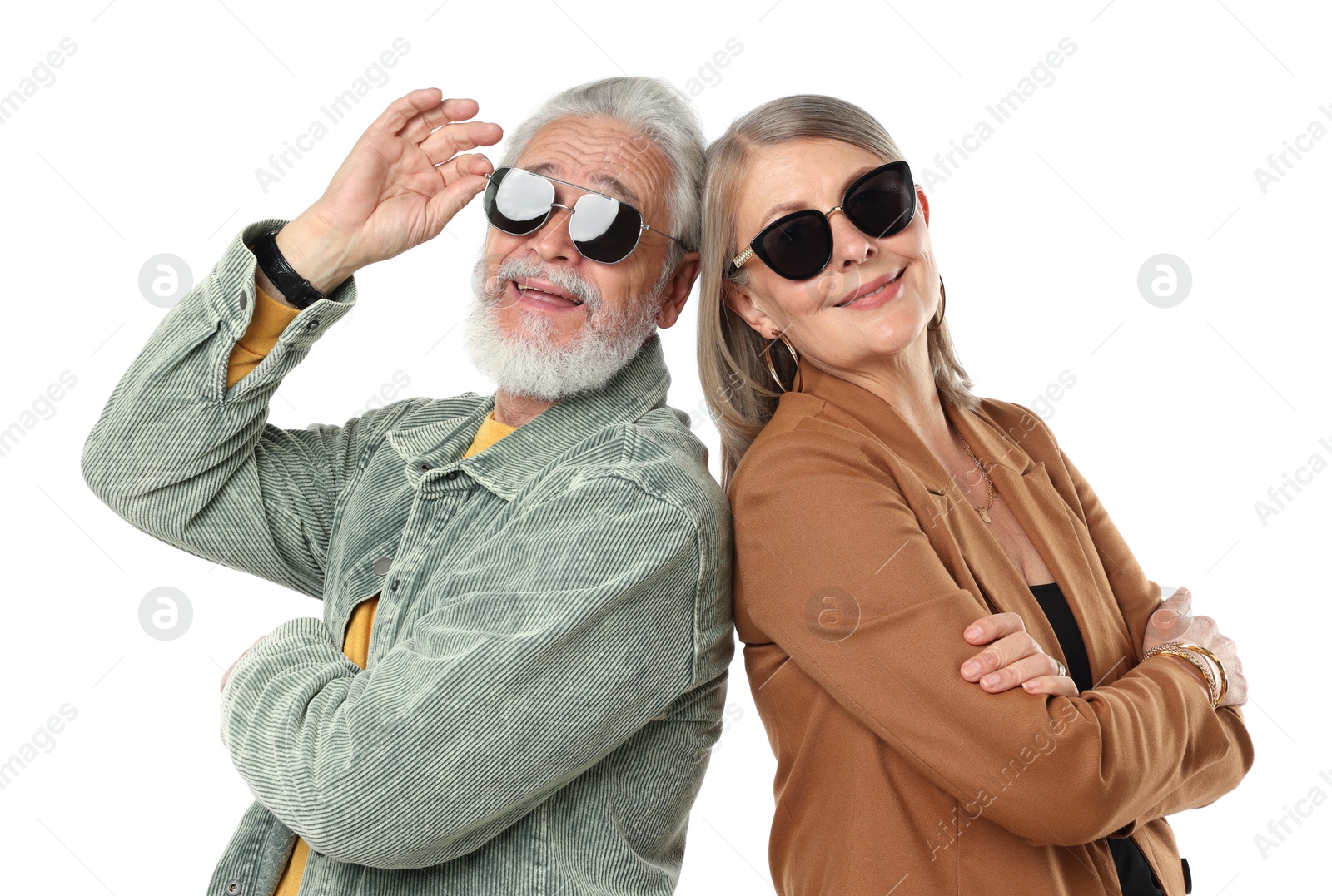 Senior couple in stylish outfits on white background Photo of Senior couple in stylish outfits on white background