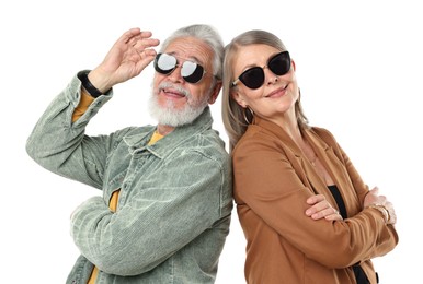 Photo of Senior couple in stylish outfits on white background