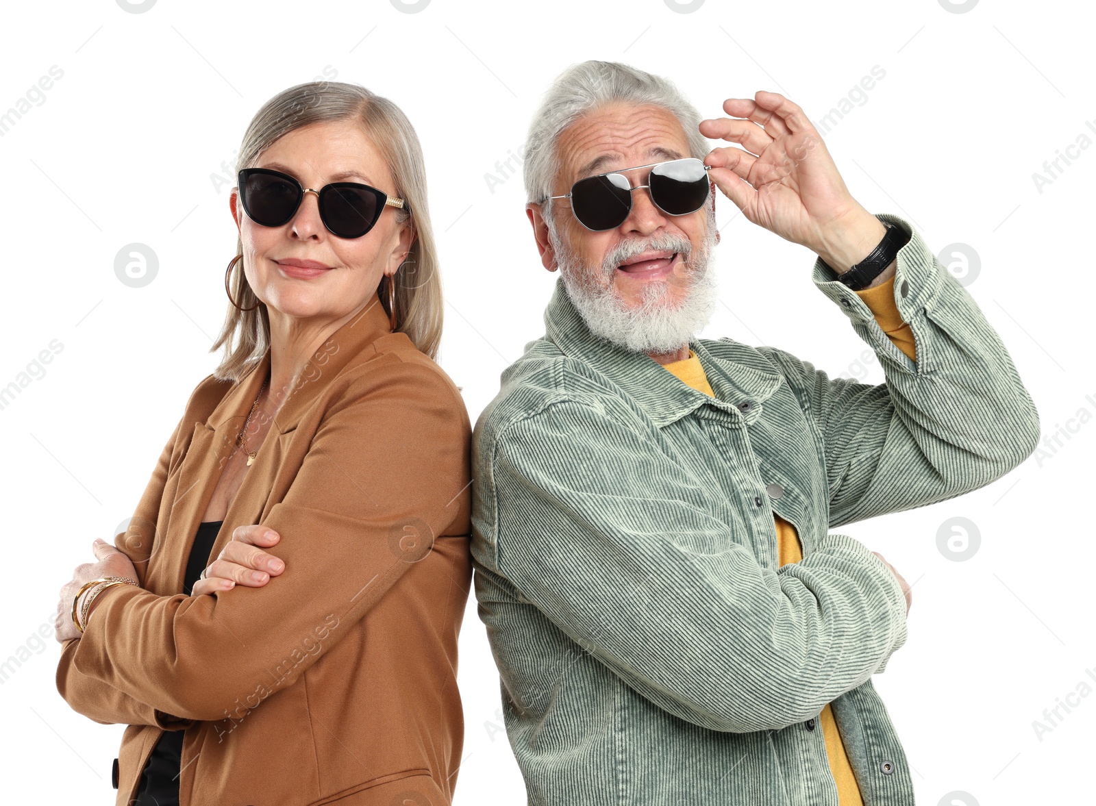 Senior couple in stylish outfits on white background Photo of Senior couple in stylish outfits on white background