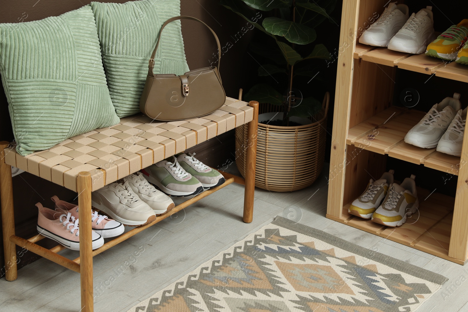 Different footwear on shelves in entryway. Shoe storage Photo of Different footwear on shelves in entryway. Shoe storage