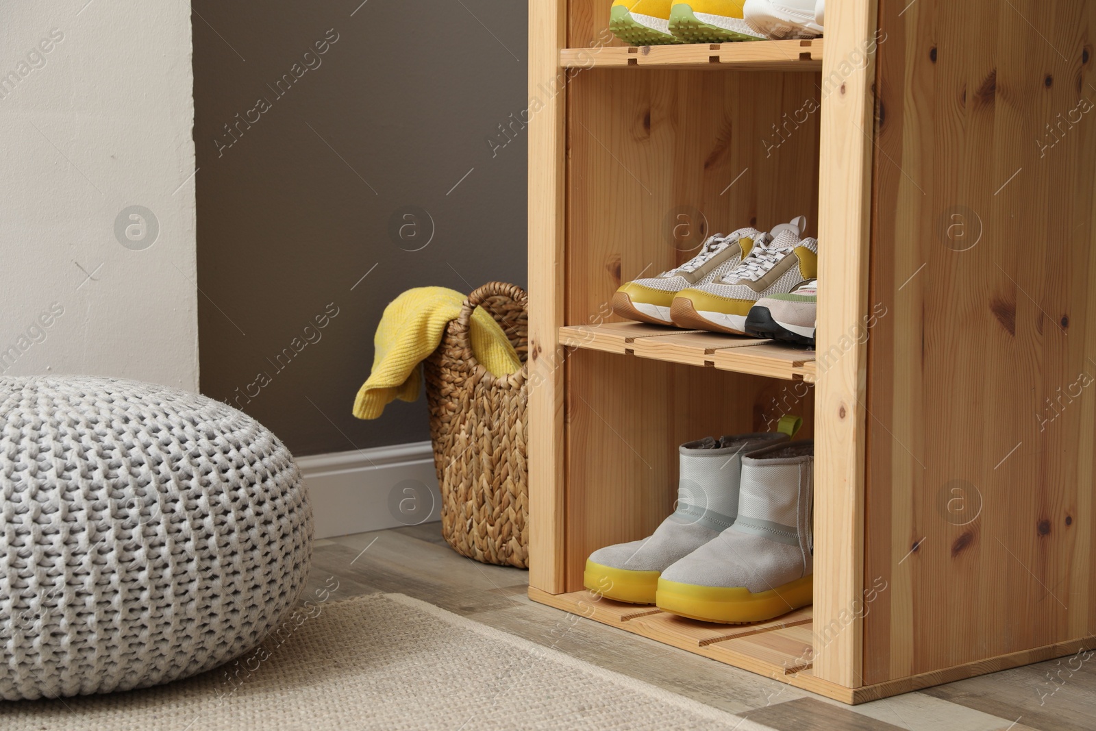 Different footwear on shelves in entryway. Shoe storage Photo of Different footwear on shelves in entryway. Shoe storage