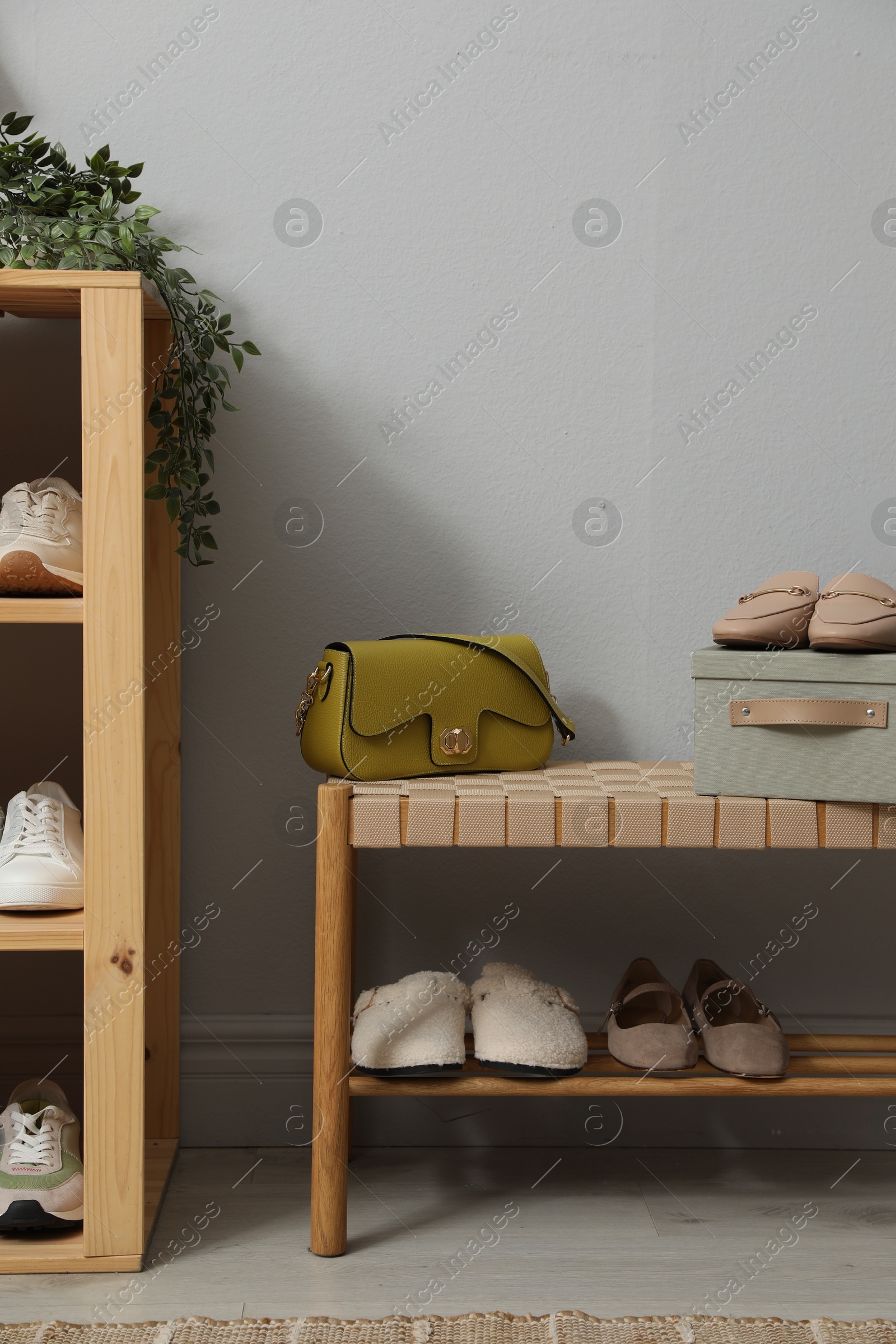 Different footwear on shelves in entryway. Shoe storage Photo of Different footwear on shelves in entryway. Shoe storage