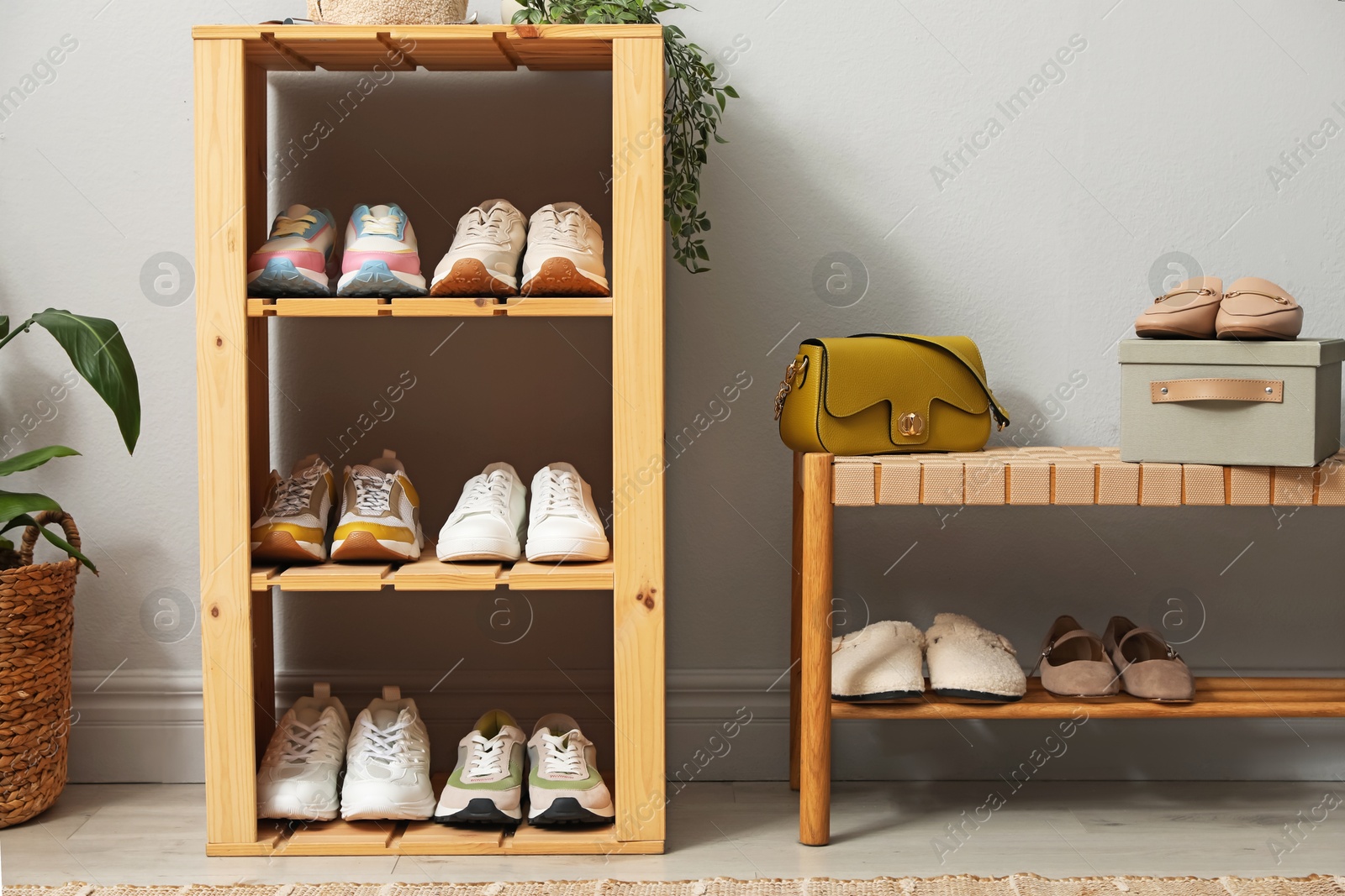 Different footwear on shelves in entryway. Shoe storage Photo of Different footwear on shelves in entryway. Shoe storage