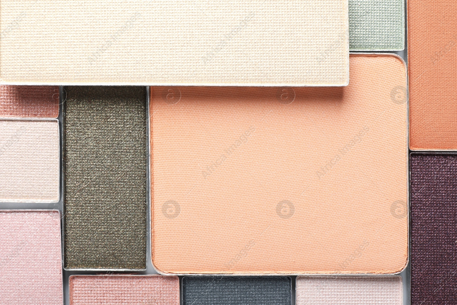 Beautiful eye shadow refill pans as background, top view Photo of Beautiful eye shadow refill pans as background, top view