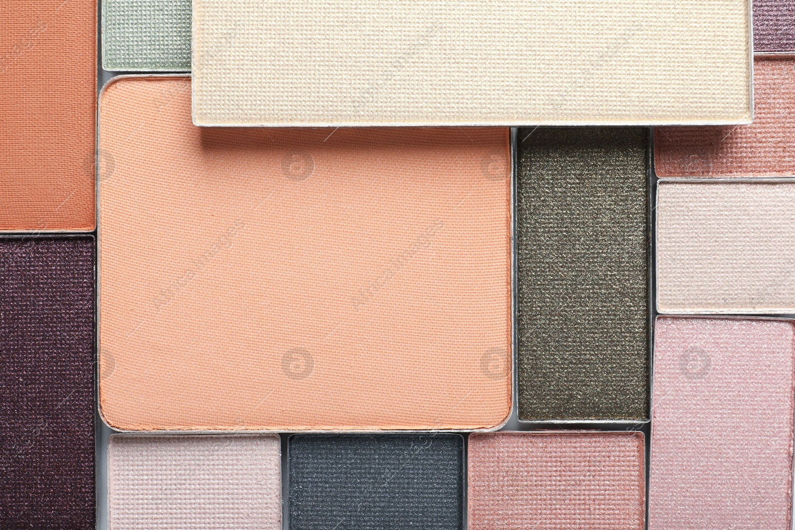 Beautiful eye shadow refill pans as background, top view Photo of Beautiful eye shadow refill pans as background, top view