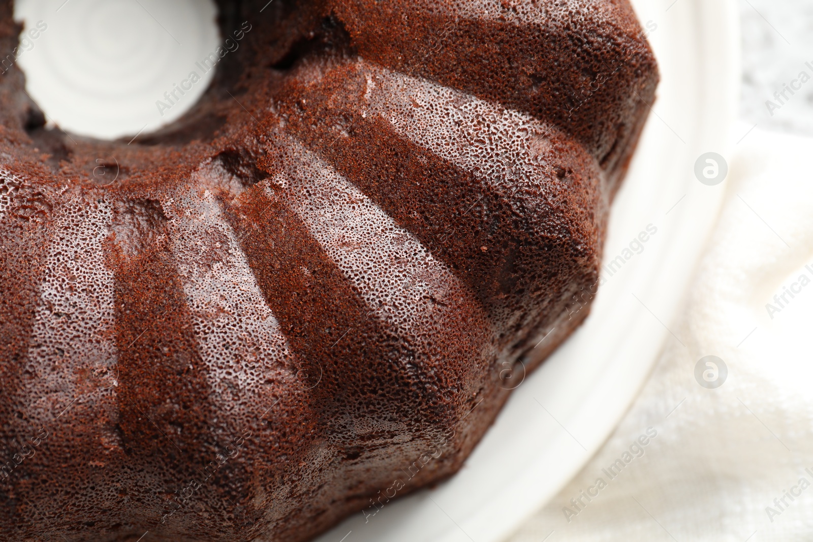 Tasty chocolate bundt cake on table, above view Photo of Tasty chocolate bundt cake on table, above view