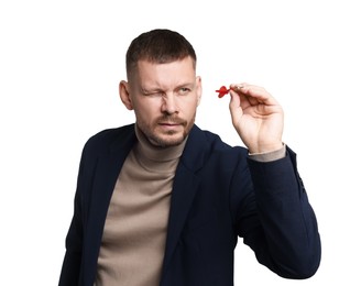 Photo of Targeting. Man with dart aiming on white background