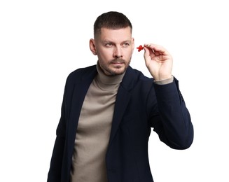 Photo of Targeting. Man with dart aiming on white background