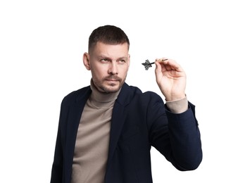 Photo of Targeting. Man with dart aiming on white background