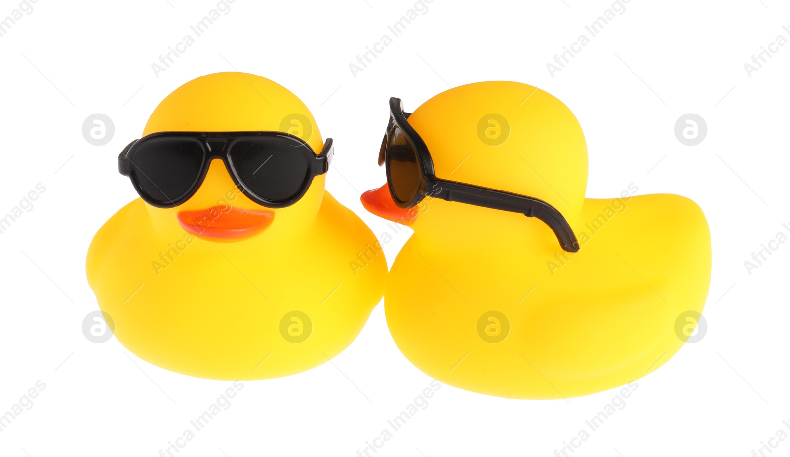 Cute rubber ducks in sunglasses isolated on white Photo of Cute rubber ducks in sunglasses isolated on white