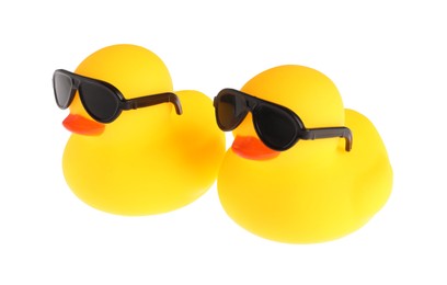 Photo of Cute rubber ducks in sunglasses isolated on white