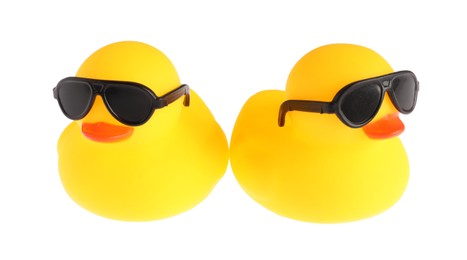 Photo of Cute rubber ducks in sunglasses isolated on white