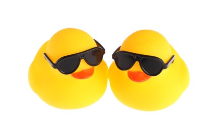 Photo of Cute rubber ducks in sunglasses isolated on white