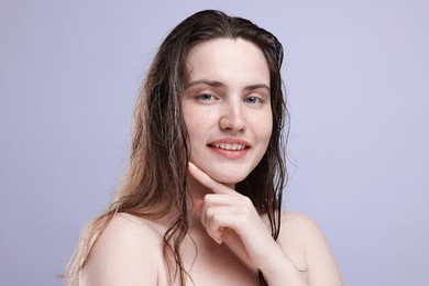 Photo of Portrait of smiling woman with natural skin complexion on grey background, closeup
