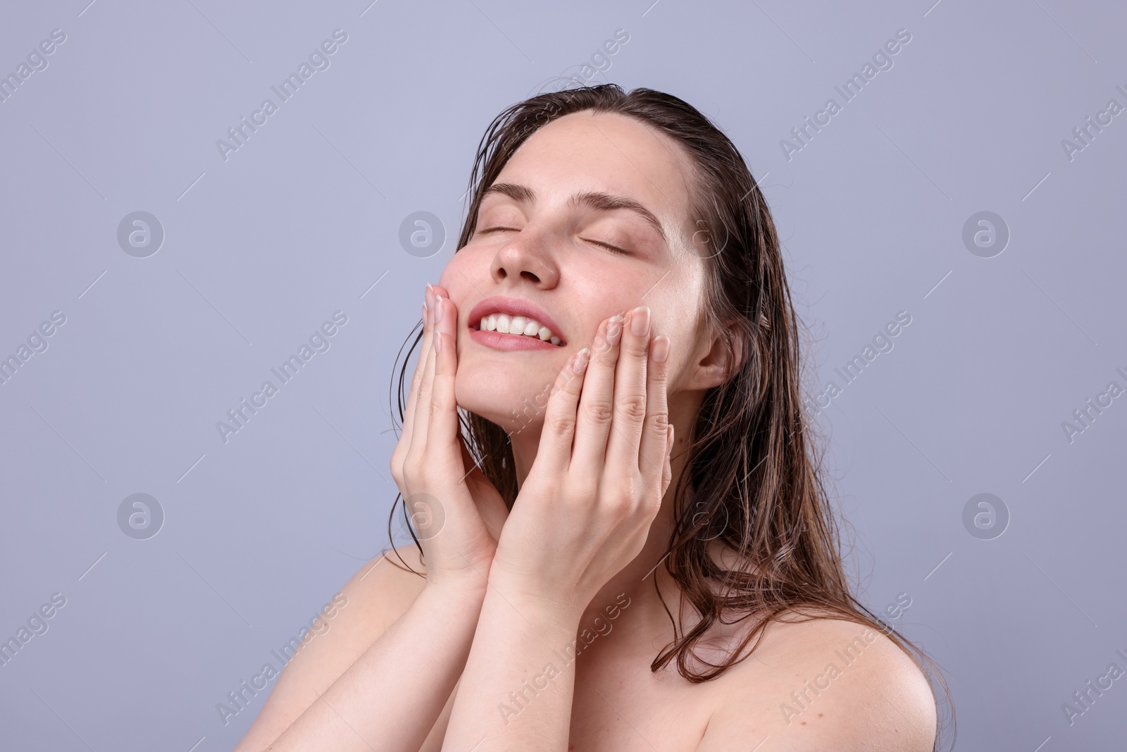 Photo of Smiling woman with natural skin complexion on grey background, closeup