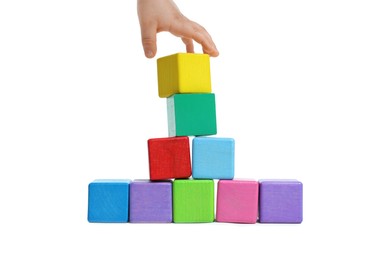 Photo of Child playing with colorful cubes on white background, closeup