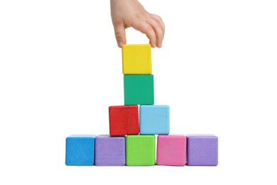 Photo of Child playing with colorful cubes on white background, closeup