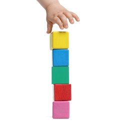 Photo of Child playing with colorful cubes on white background, closeup