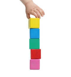 Photo of Child playing with colorful cubes on white background, closeup