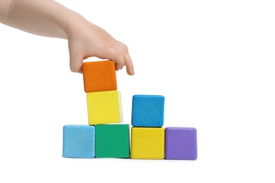 Photo of Child playing with colorful cubes on white background, closeup
