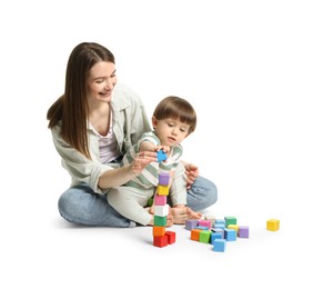 Photo of Mother and son playing with colorful cubes on white background