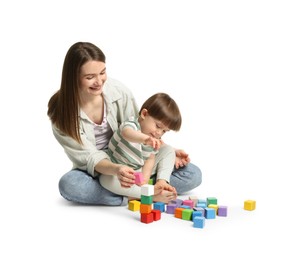 Photo of Mother and son playing with colorful cubes on white background