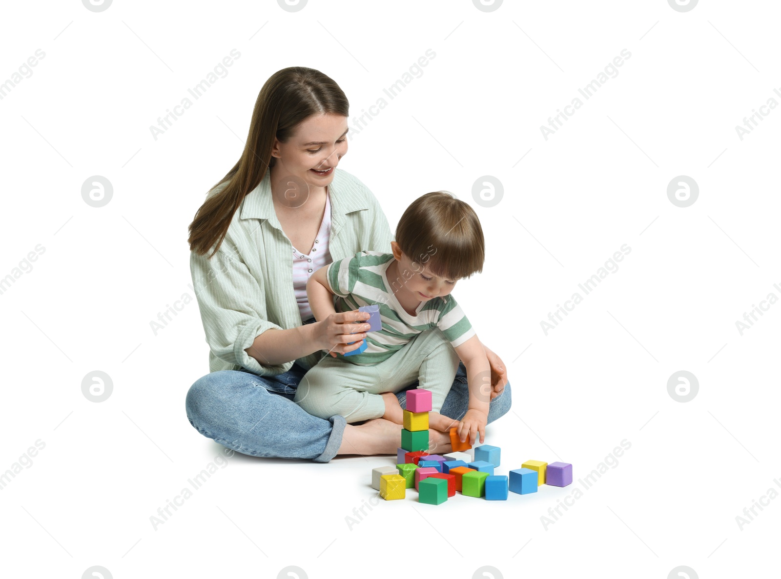 Photo of Mother and son playing with colorful cubes on white background