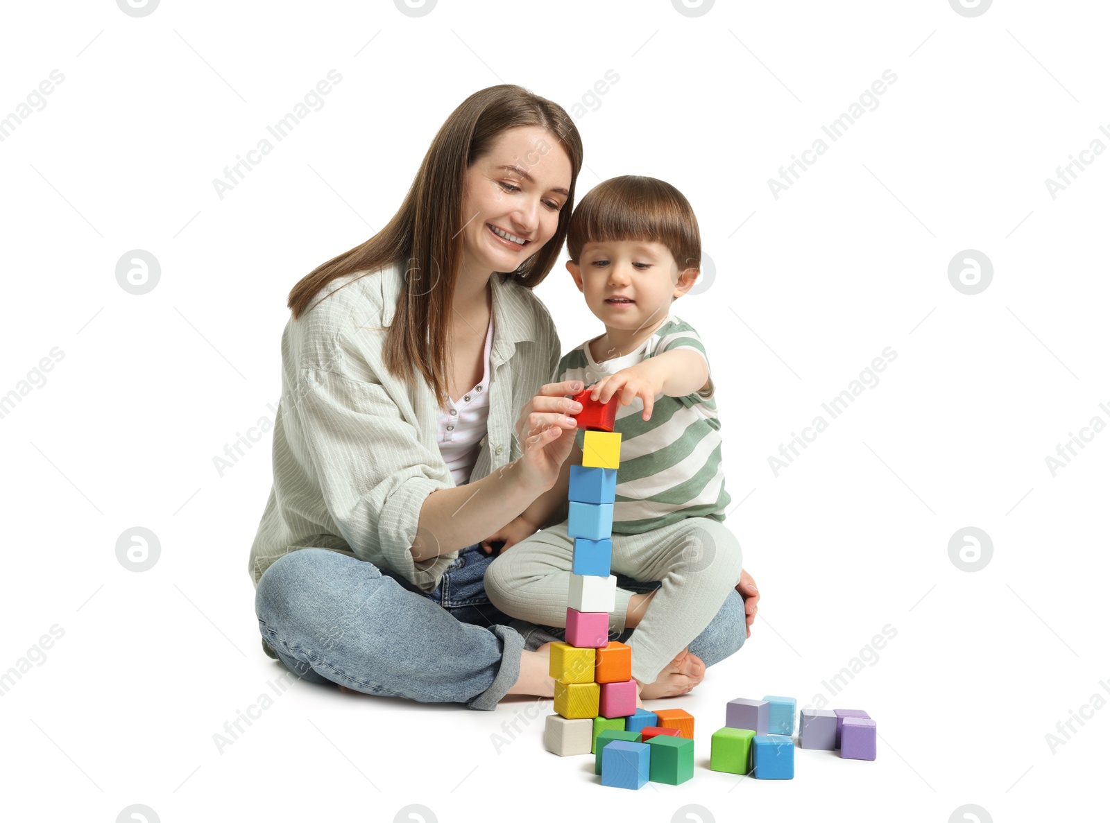 Photo of Mother and son playing with colorful cubes on white background