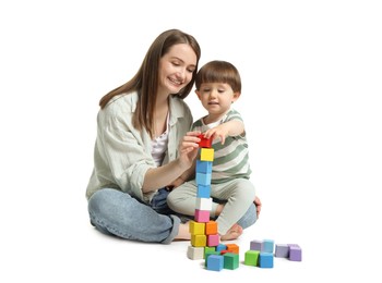 Photo of Mother and son playing with colorful cubes on white background