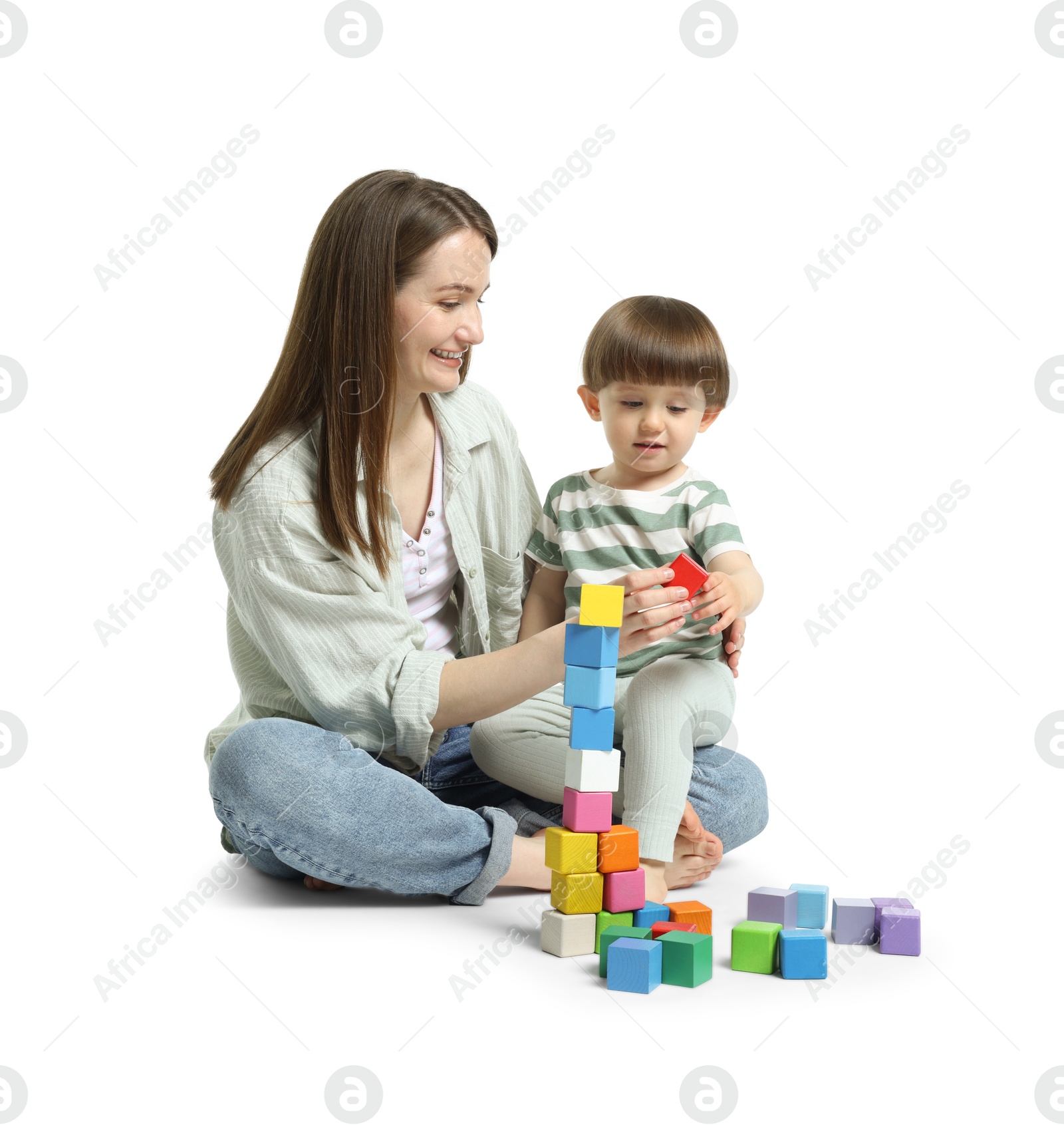 Mother and son playing with colorful cubes on white background Photo of Mother and son playing with colorful cubes on white background