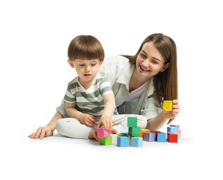 Photo of Mother and son playing with colorful cubes on white background