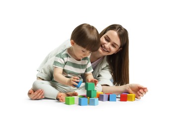 Photo of Mother and son playing with colorful cubes on white background