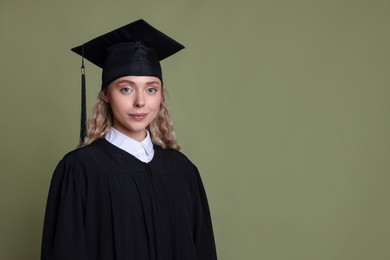 Photo of Student after graduation on green background. Space for text