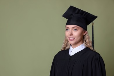 Photo of Happy student after graduation on green background. Space for text