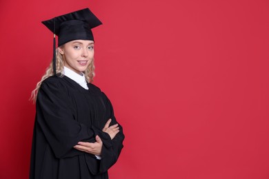 Photo of Happy student after graduation on red background. Space for text
