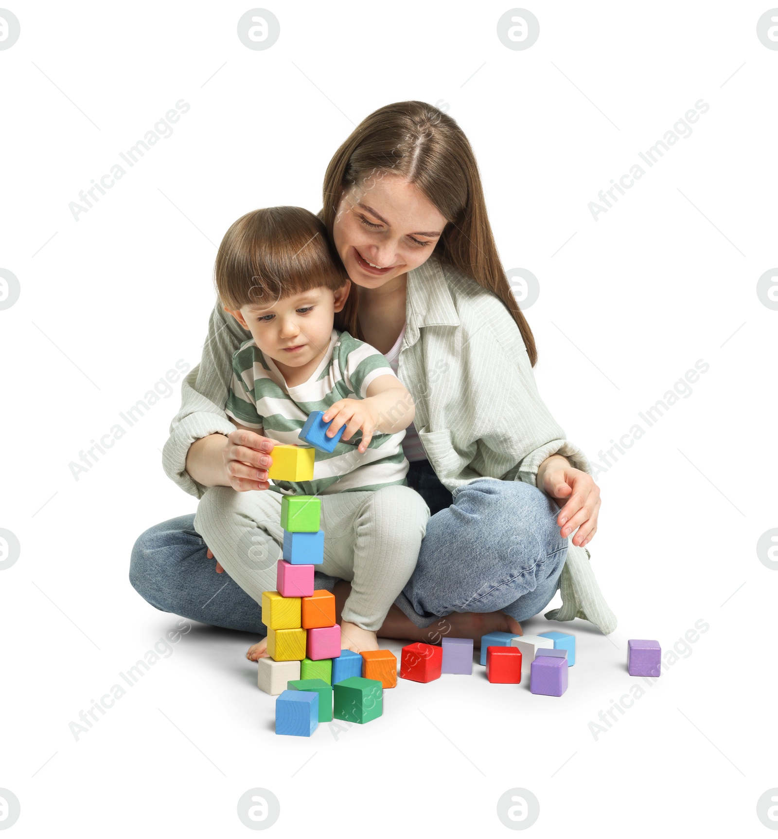 Mother and son playing with colorful cubes on white background Photo of Mother and son playing with colorful cubes on white background