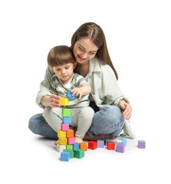 Photo of Mother and son playing with colorful cubes on white background