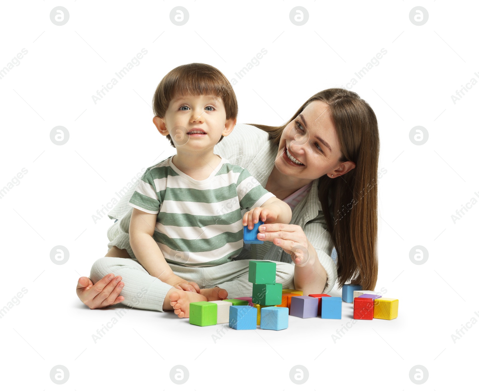 Mother and son playing with colorful cubes on white background Photo of Mother and son playing with colorful cubes on white background