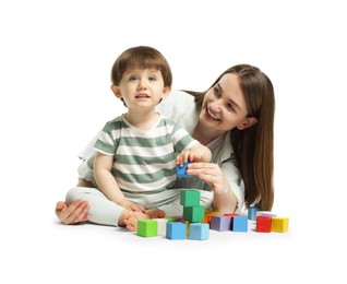 Photo of Mother and son playing with colorful cubes on white background