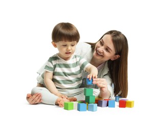 Photo of Mother and son playing with colorful cubes on white background