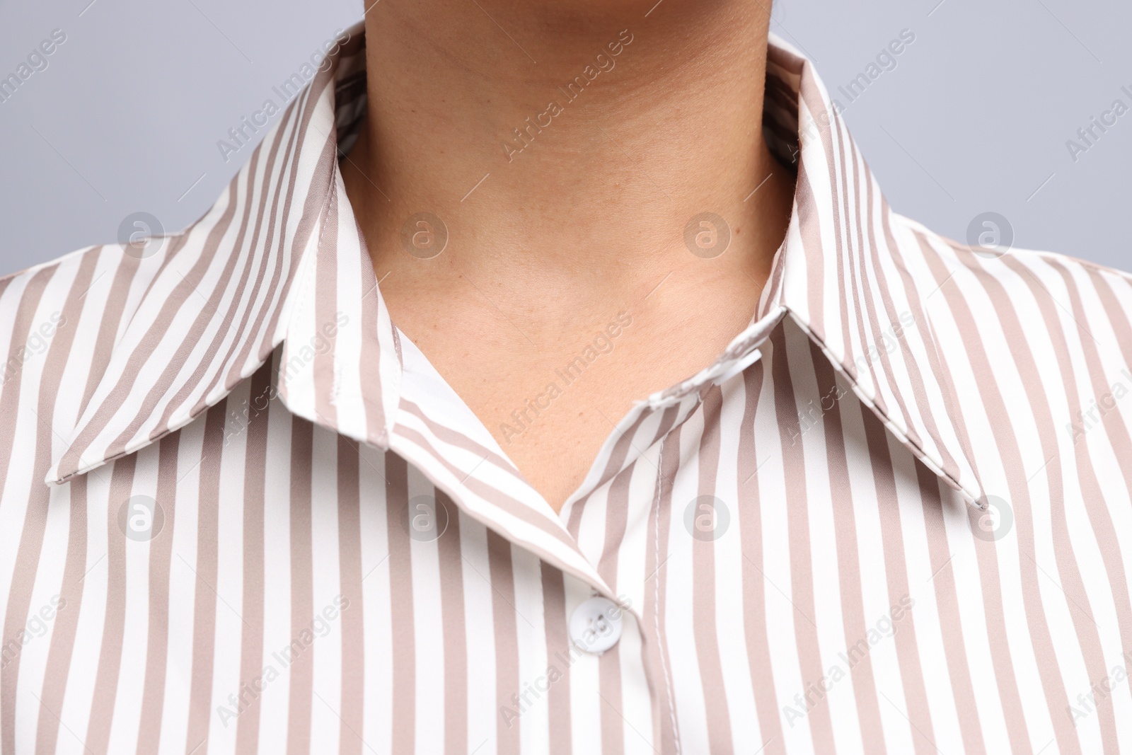 Photo of Young woman with healthy skin on light grey background, closeup