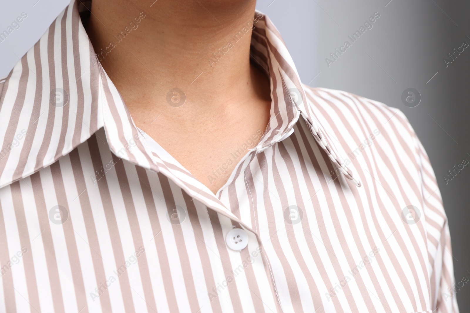 Photo of Young woman with healthy skin on light grey background, closeup